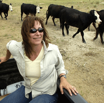 Kathy Voth, in her natural habitat, helping ranchers and farmers.